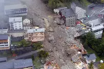 Aerial view of a town severely damaged by storms in Valais and Ticino, Switzerland, supported by Swiss Solidarity’s 2000 relief campaign.