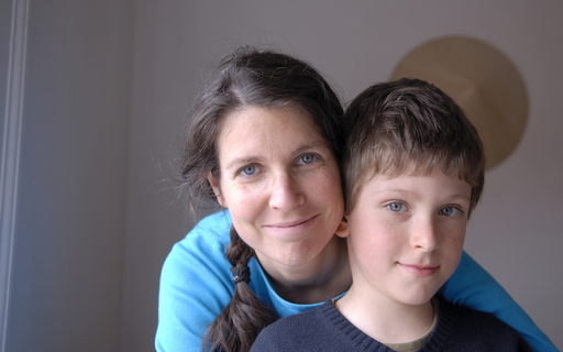 A mother embraces her son - solidarity with children offers protection, care and access to education.